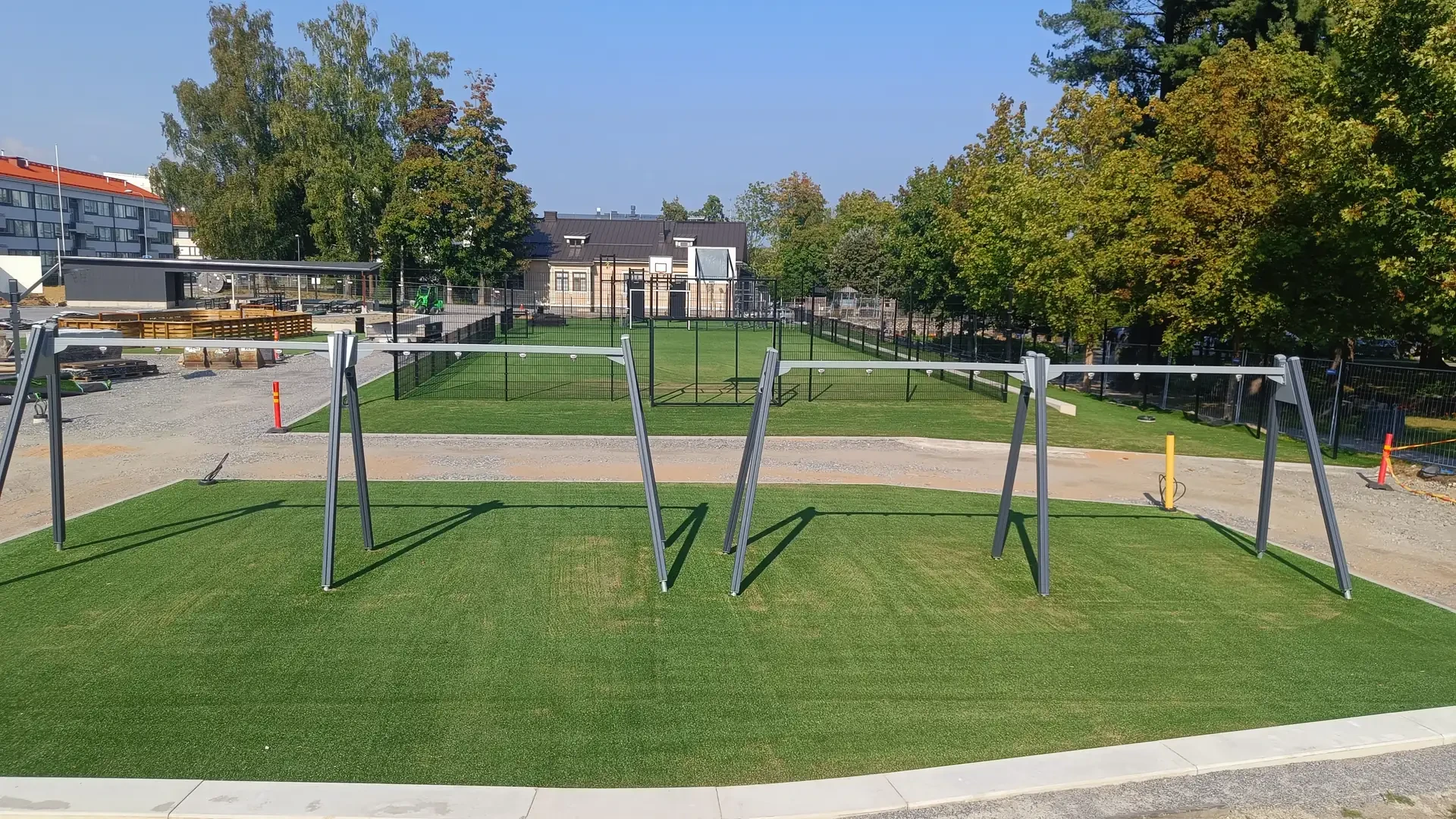 Sand-filled artificial grass installation in progress